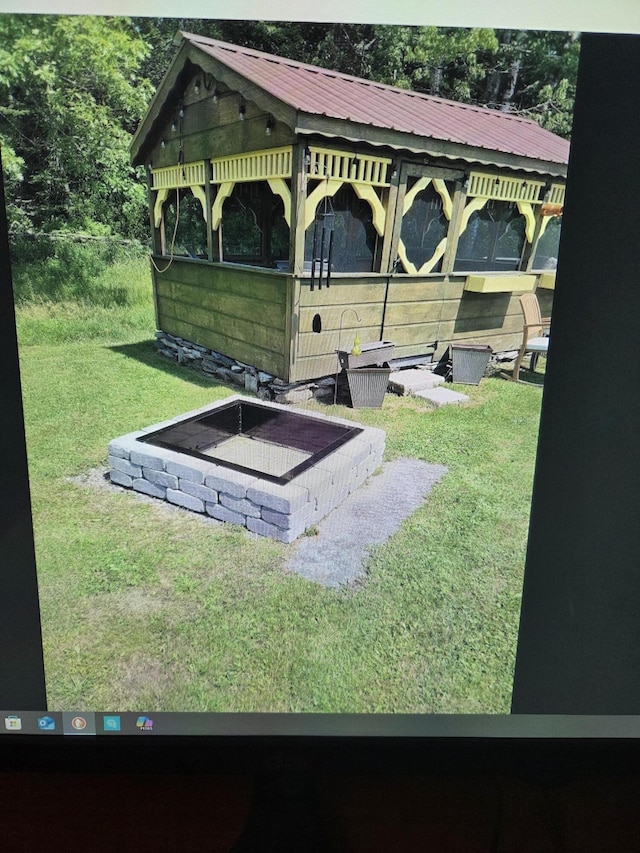 view of storm shelter with a lawn