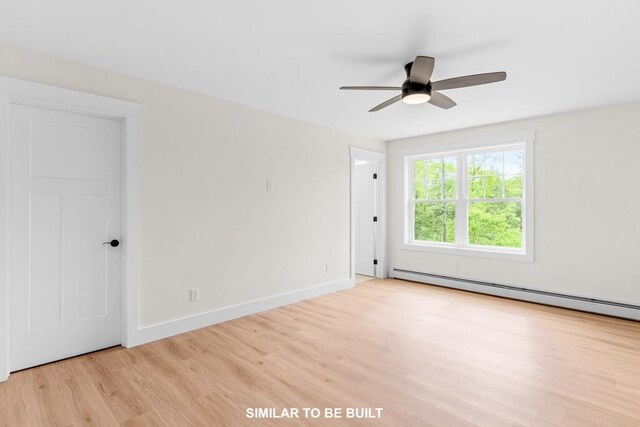 LOT11 Raspberry Ln, Topsham, ME 04086 - empty room featuring baseboards, baseboard heating, wood finished floors, and a ceiling fan
