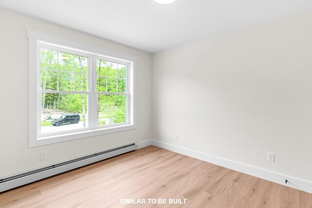 LOT11 Raspberry Ln, Topsham, ME 04086 - spare room with baseboards, wood finished floors, and baseboard heating