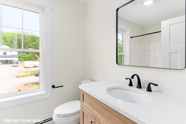 LOT11 Raspberry Ln, Topsham, ME 04086 - bathroom featuring toilet, vanity, and a baseboard radiator