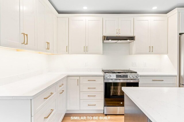 LOT11 Raspberry Ln, Topsham, ME 04086 - kitchen featuring light stone counters, stainless steel range with gas cooktop, under cabinet range hood, and white cabinets