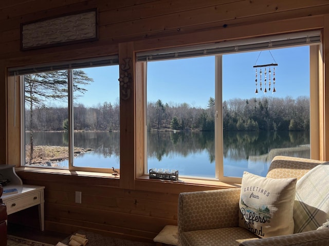 35 Swan Ln, Dexter, ME 04930 - sunroom with wood walls, a view of trees, a water view, and plenty of natural light