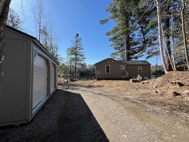 35 Swan Ln, Dexter, ME 04930 - view of home's exterior with dirt driveway