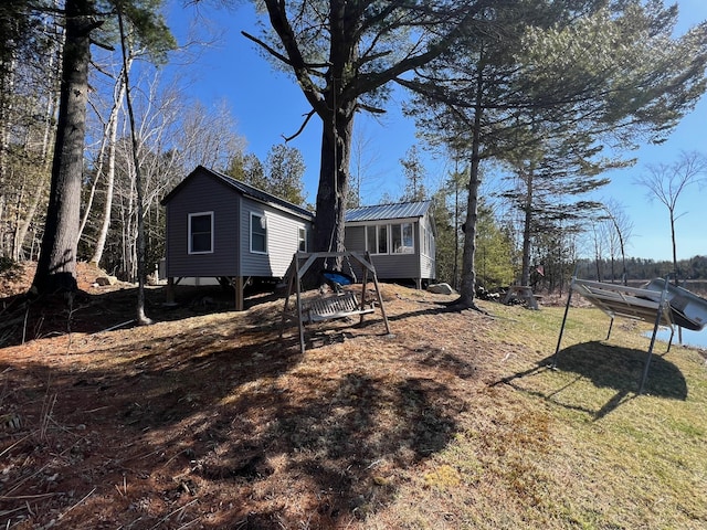 35 Swan Ln, Dexter, ME 04930 - back of house featuring metal roof
