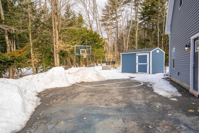 view of patio / terrace with an outdoor structure and a shed