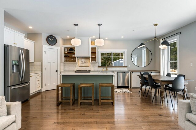 kitchen with open shelves, a sink, appliances with stainless steel finishes, white cabinets, and light countertops