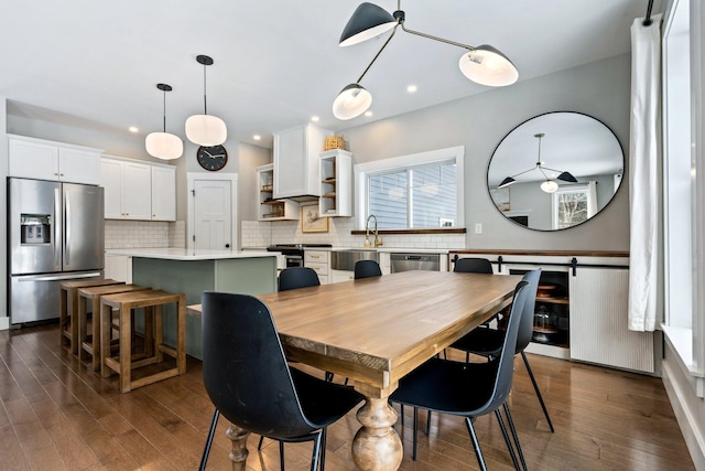 dining area featuring recessed lighting and dark wood-type flooring