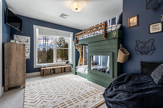 bedroom with visible vents, baseboards, and carpet