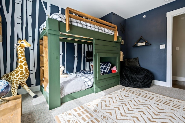 bedroom featuring a fireplace, baseboards, and carpet floors