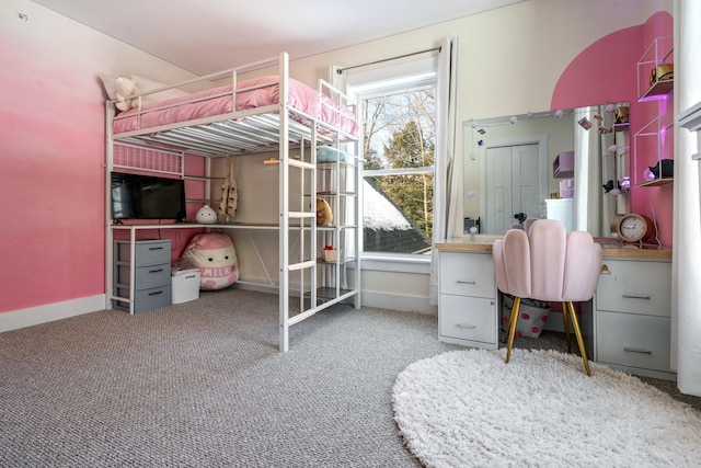 bedroom featuring baseboards and carpet floors