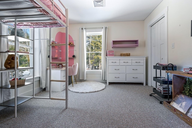 bedroom with visible vents and carpet floors