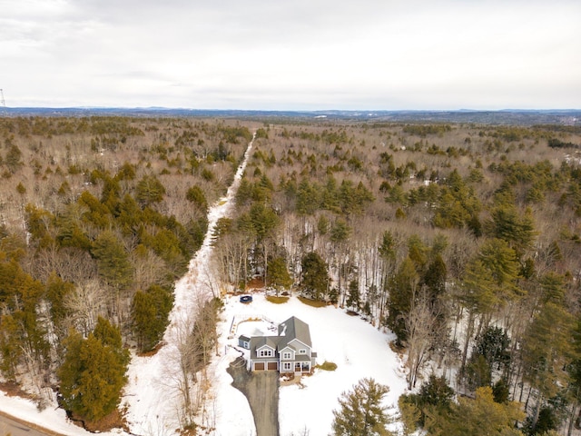 drone / aerial view featuring a view of trees