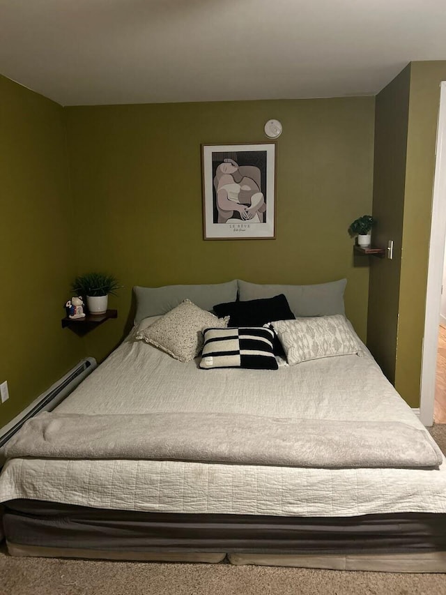 bedroom featuring a baseboard heating unit