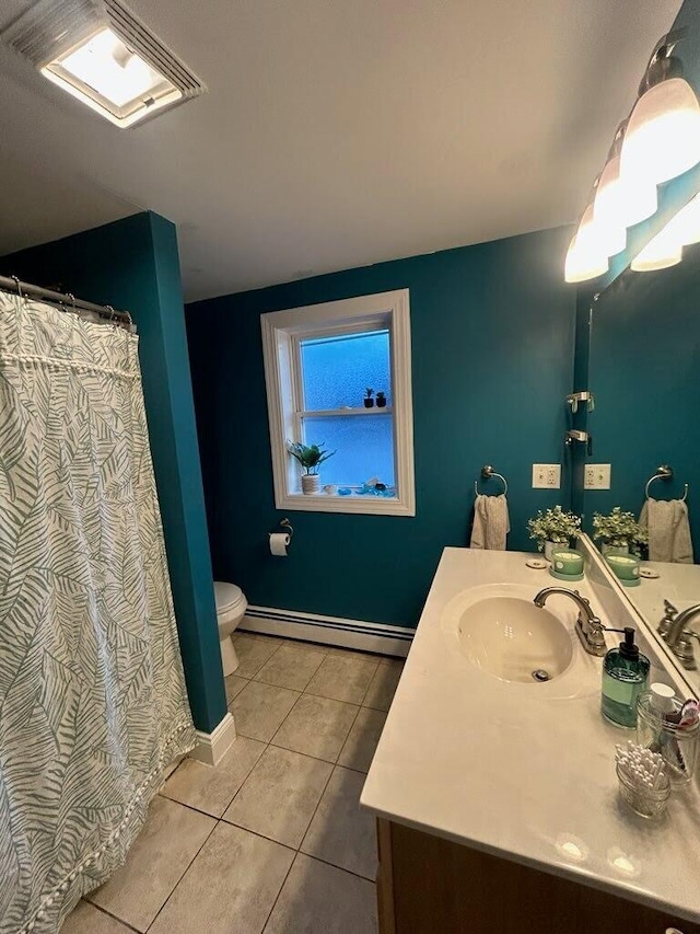 full bathroom with a baseboard radiator, tile patterned flooring, toilet, vanity, and baseboards