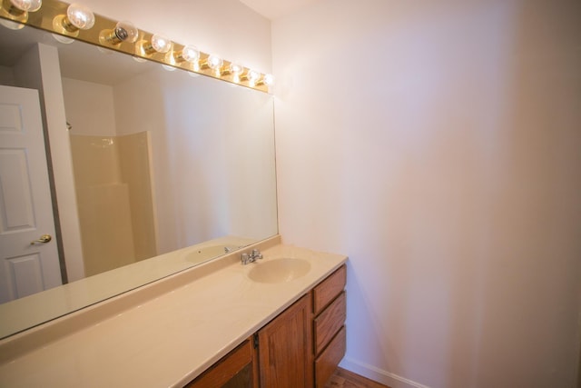 full bathroom with a shower and vanity