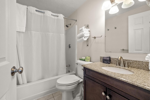 bathroom with shower / tub combo, toilet, tile patterned floors, a textured ceiling, and vanity