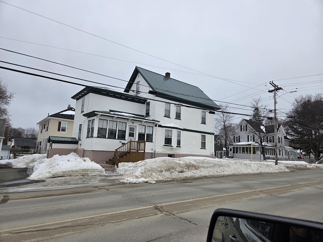 view of front of home with a residential view