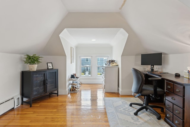 home office featuring vaulted ceiling, light wood finished floors, baseboards, and baseboard heating