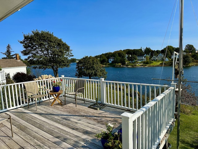 wooden terrace with a water view