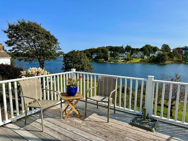 deck featuring a water view