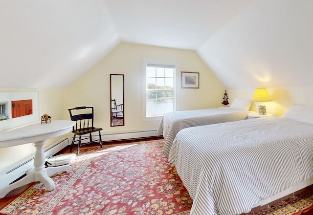 bedroom with lofted ceiling, wood finished floors, and baseboards