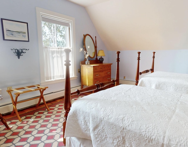 bedroom with a baseboard heating unit and lofted ceiling