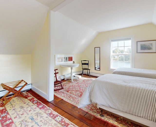 bedroom with lofted ceiling, baseboards, and hardwood / wood-style flooring