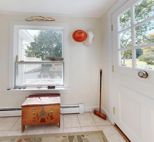 doorway to outside featuring a baseboard heating unit, crown molding, and tile patterned floors