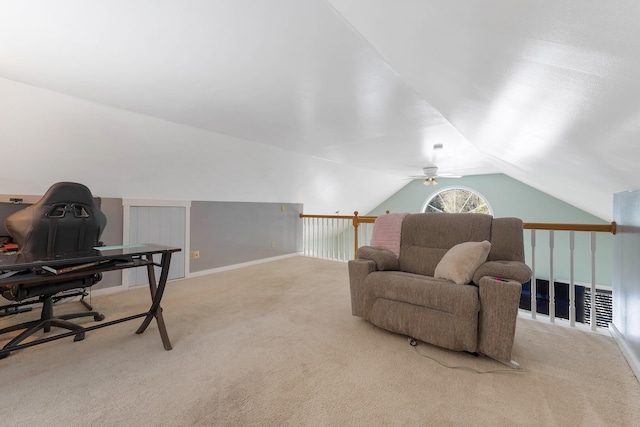 living area with vaulted ceiling, baseboards, and carpet floors