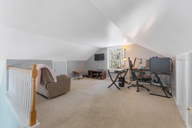 interior space featuring lofted ceiling and carpet floors