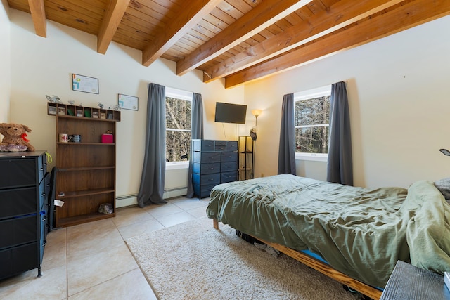 bedroom with a baseboard heating unit, beam ceiling, wooden ceiling, and light tile patterned flooring