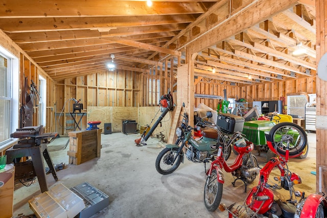 interior space featuring lofted ceiling and a garage