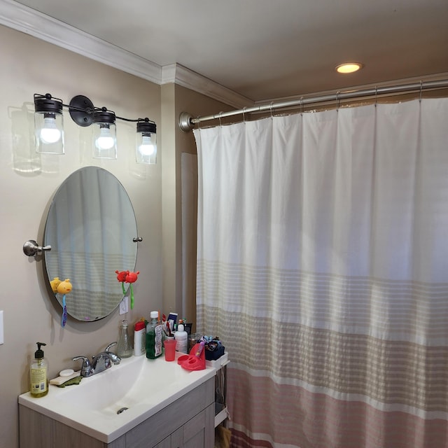 bathroom with vanity and crown molding