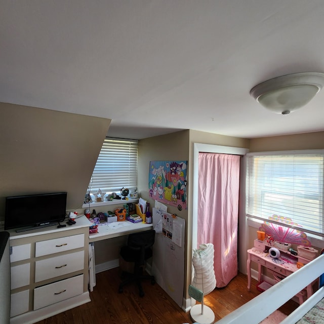 bedroom featuring dark wood-style flooring