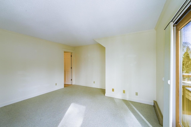 carpeted spare room featuring a baseboard radiator and baseboards