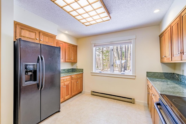 kitchen with range with electric cooktop, black fridge with ice dispenser, brown cabinets, baseboard heating, and a textured ceiling