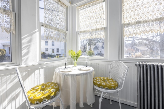 sunroom / solarium featuring radiator