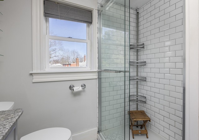 full bath featuring a shower stall, toilet, and vanity