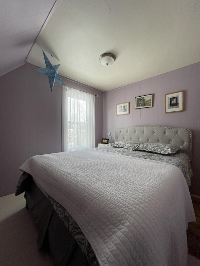 bedroom featuring vaulted ceiling