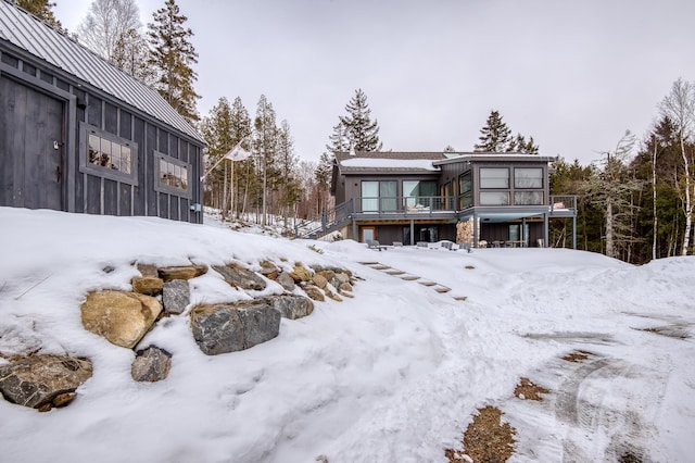 snowy yard with a garage