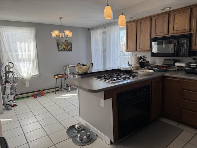 kitchen featuring black appliances, light tile patterned floors, a baseboard heating unit, and brown cabinets