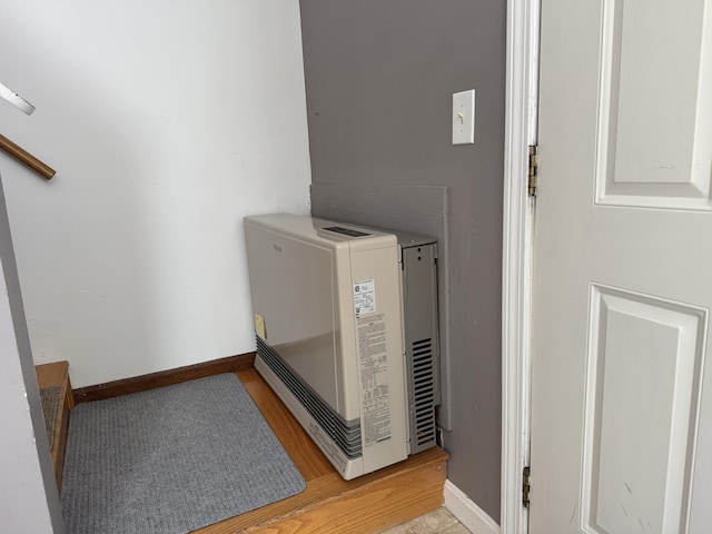 interior details featuring baseboards and wood finished floors