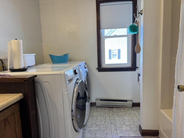 washroom with a baseboard radiator, baseboards, and washer and dryer