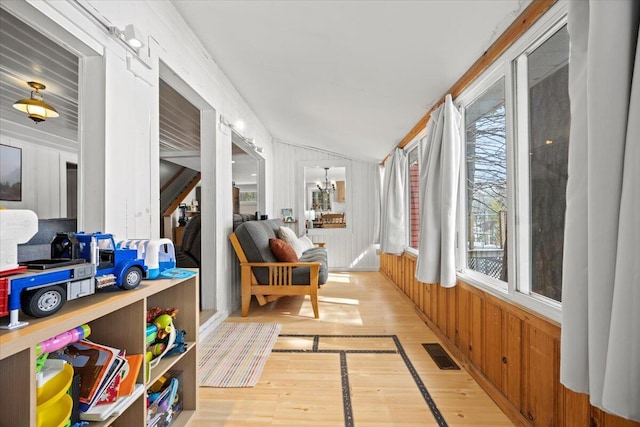 sunroom with vaulted ceiling and visible vents