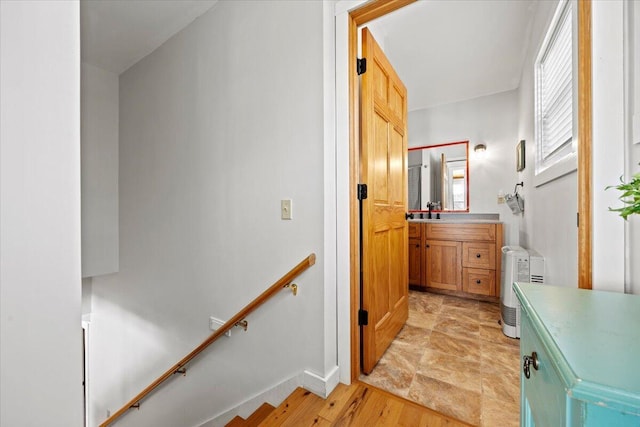 bathroom with vanity and wood finished floors