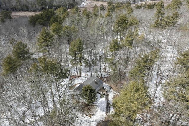 drone / aerial view featuring a forest view