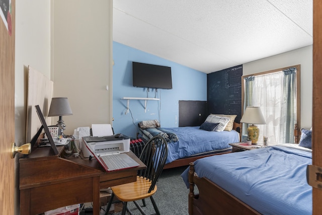 carpeted bedroom with a textured ceiling and lofted ceiling