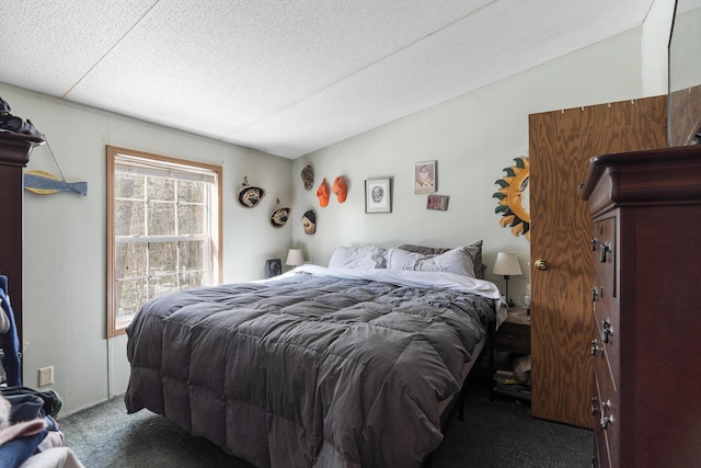 carpeted bedroom with vaulted ceiling and a textured ceiling