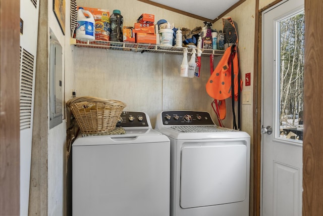 clothes washing area with washer and dryer and laundry area