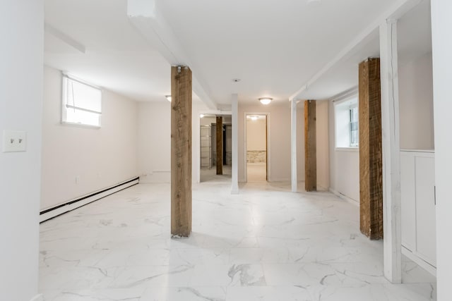 interior space with marble finish floor and a baseboard radiator